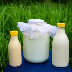 a bottle of milk, a bottle of milk and a bottle of milk on a